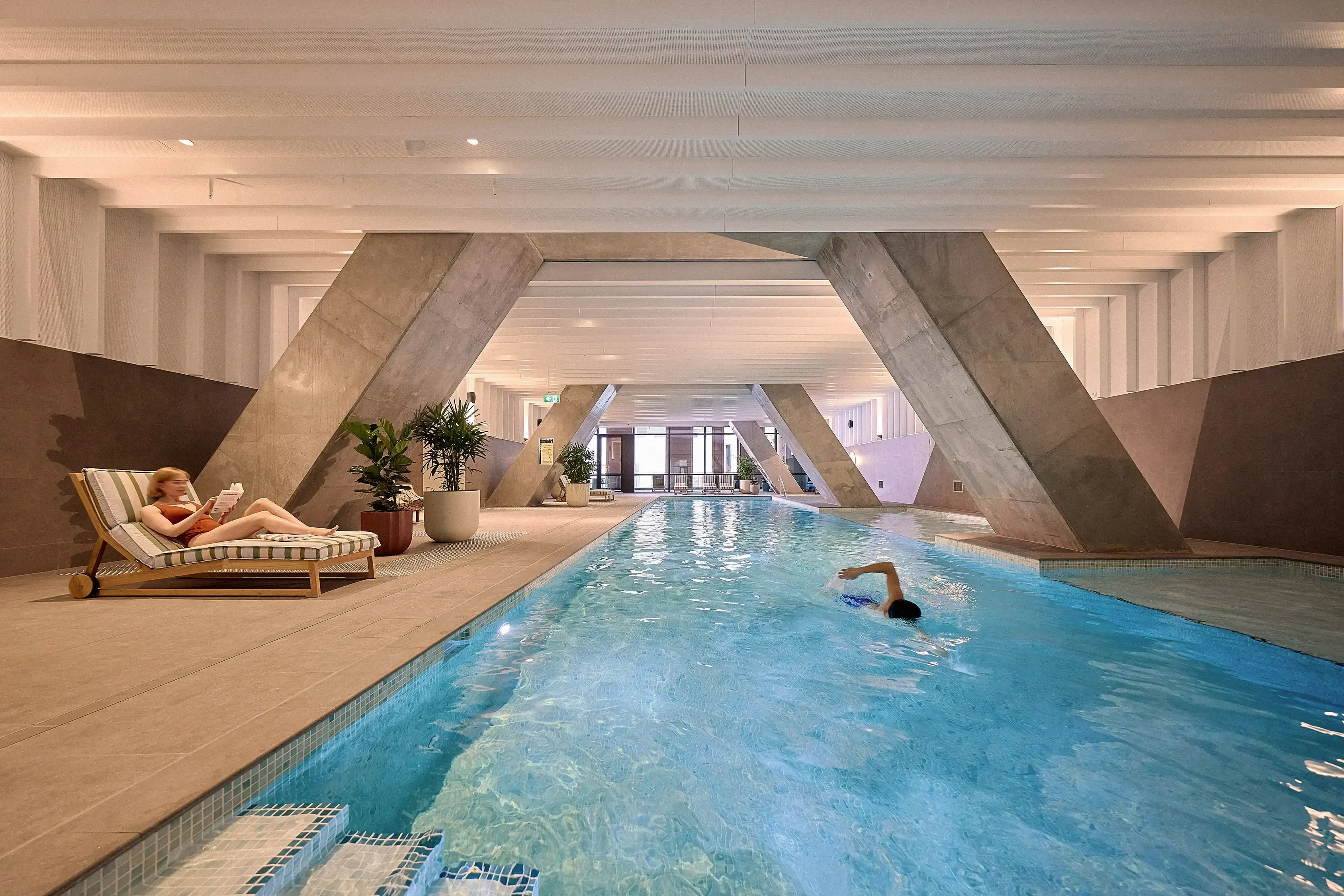 Indi Sydney indoor heated pool with exposed concrete columns