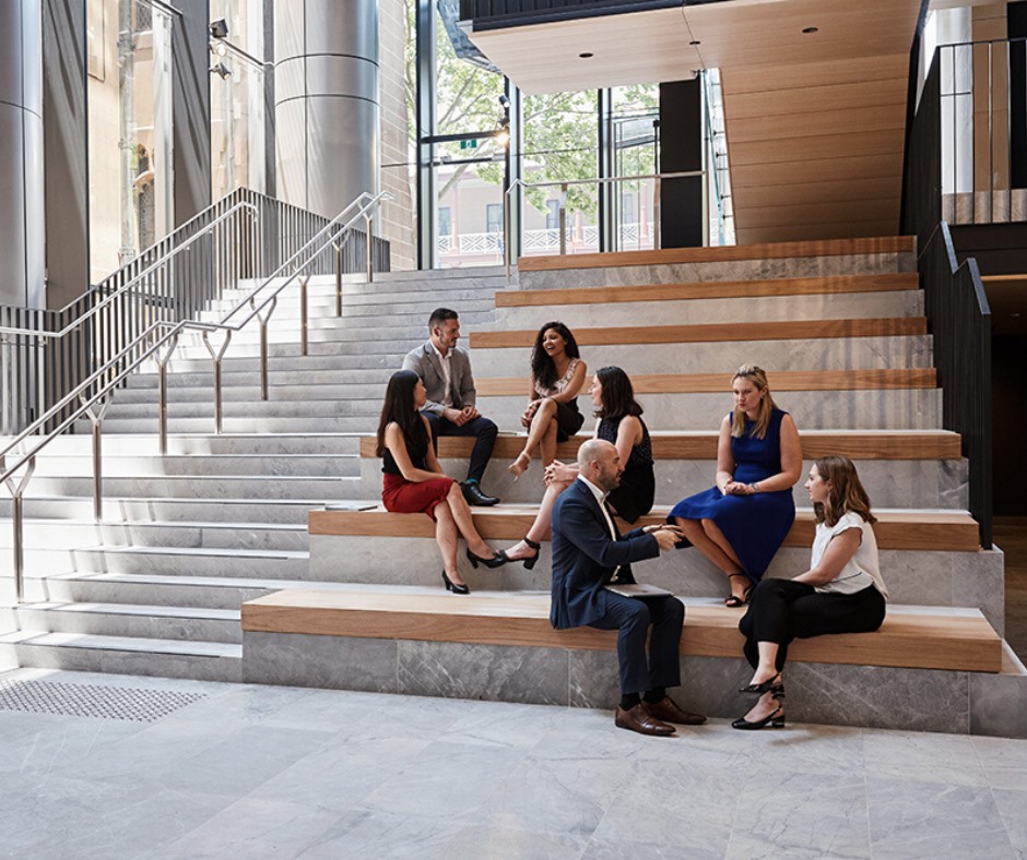 people sitting on steps inside building